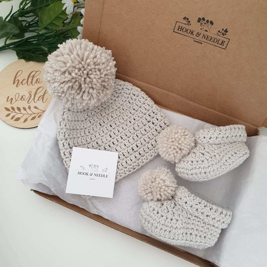 Cotton baby pom pom hat and booties oatmeal