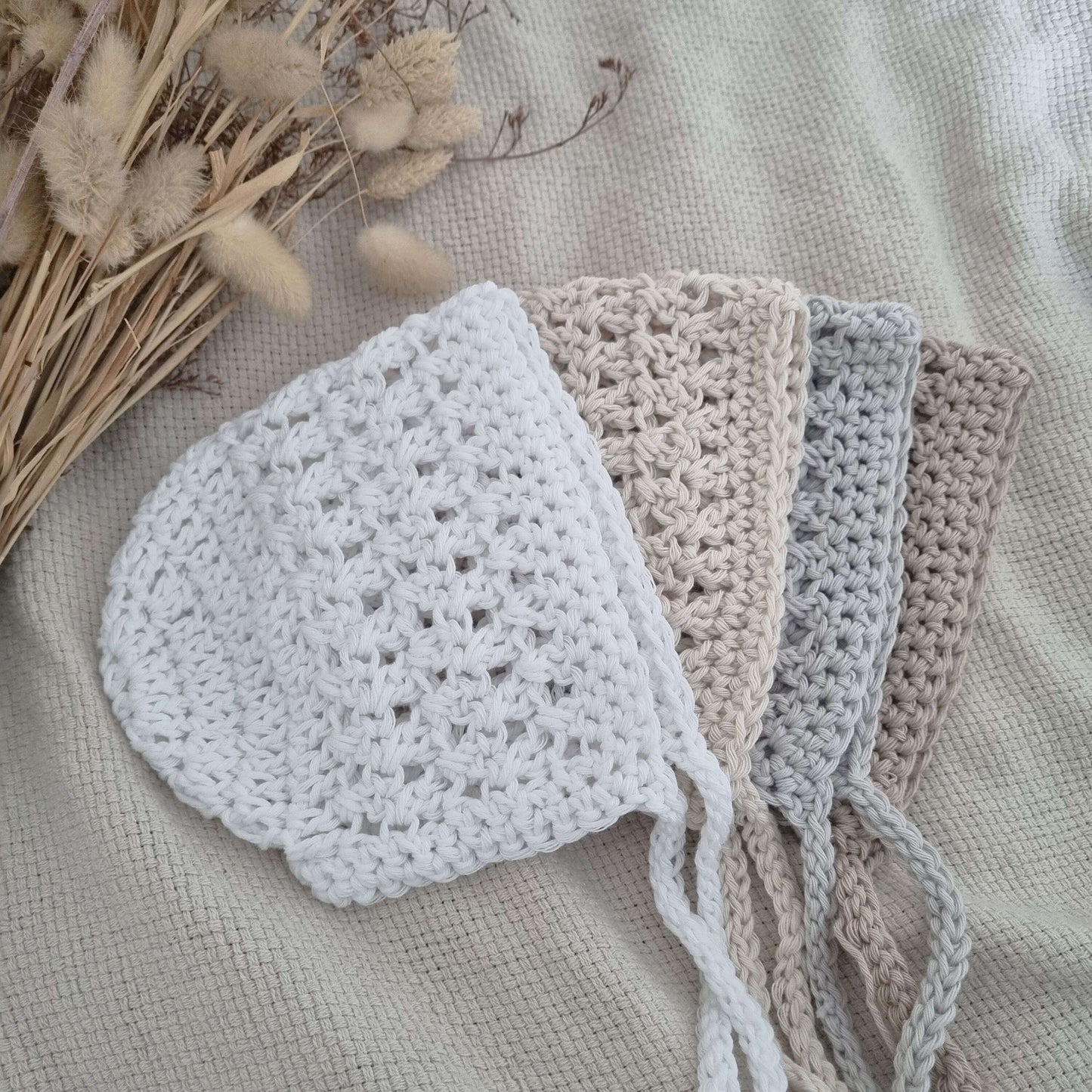 Adorable crochet baby bonnets, perfect for keeping little ones cozy and stylish. A sweet accessory for any outfit.