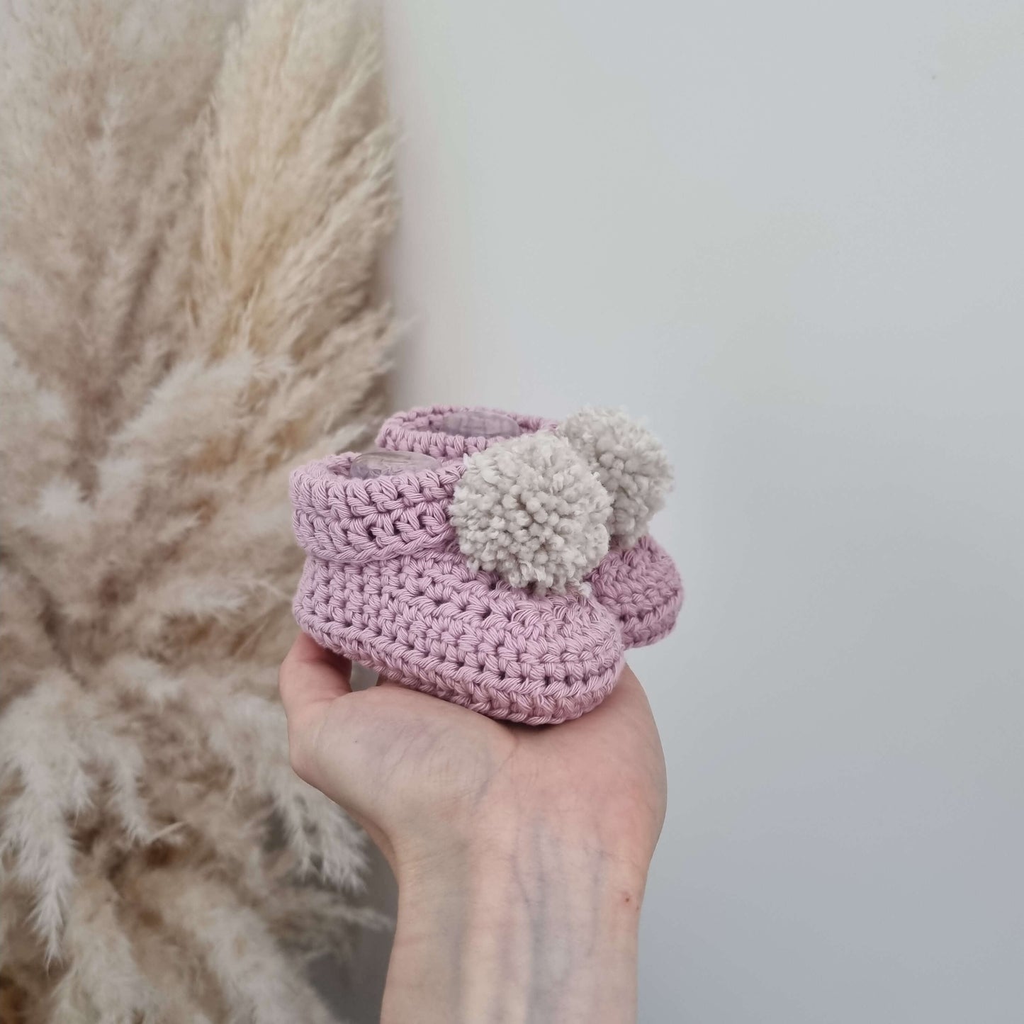 Baby Hat & Boots Set - Blossom Pom Pom, featuring soft pink crochet boots with pom pom details, perfect for little ones.