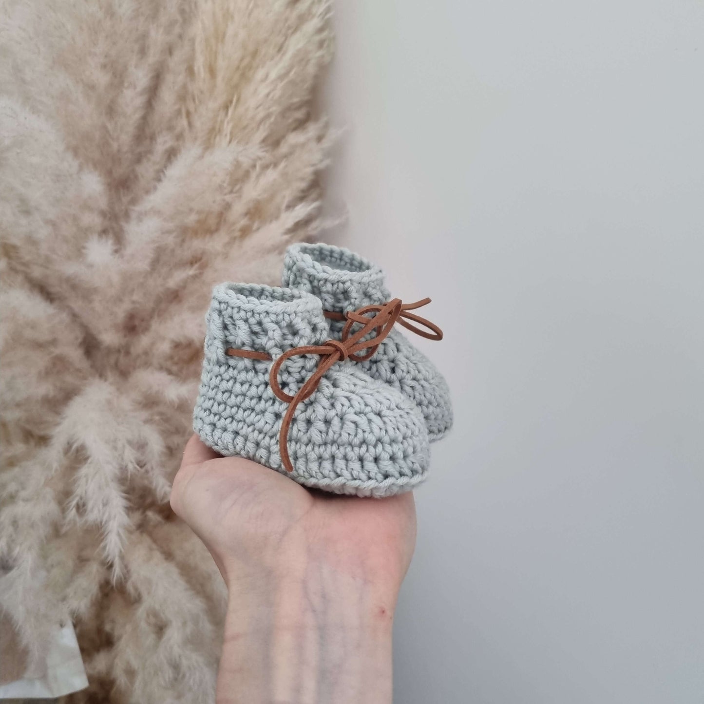 Handmade Merino Wool Baby Hat and Boots Set in grey, featuring soft crochet booties with lace-up detail.