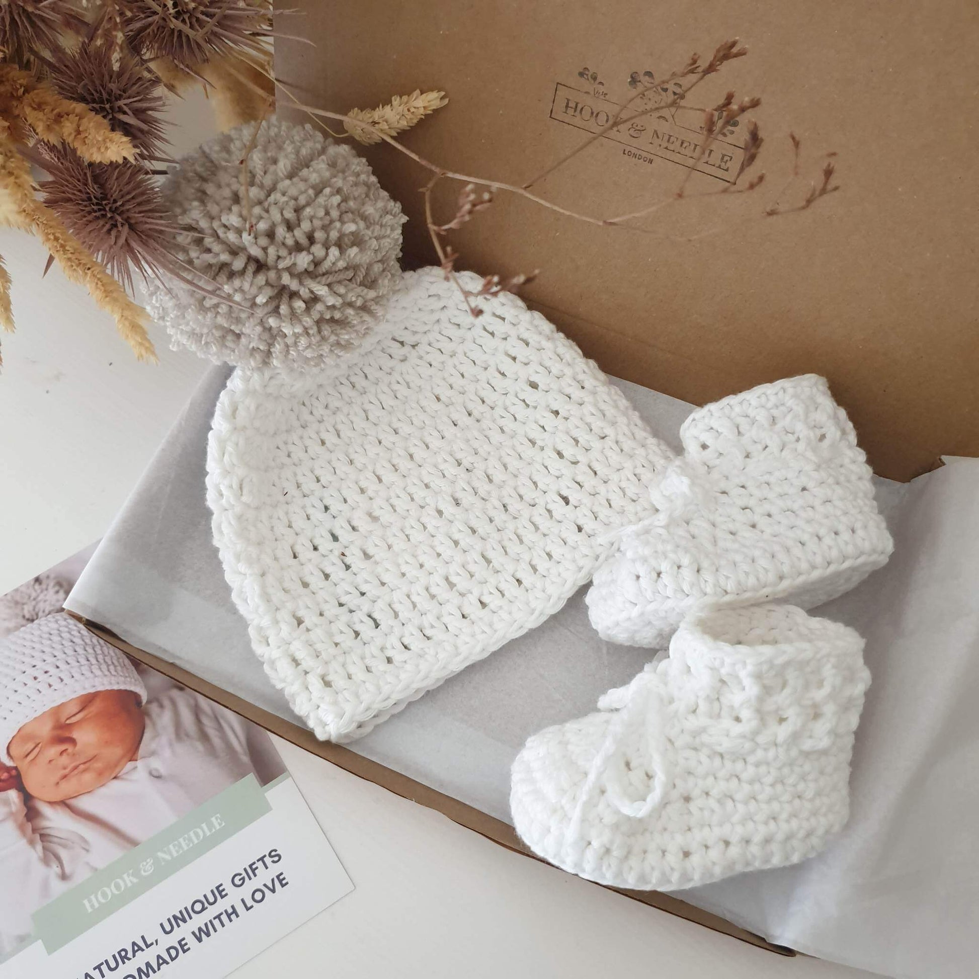 Cotton baby booties and pom pom hat white