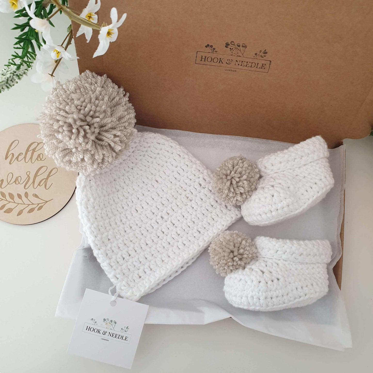 Handmade baby hat and boot set in white cotton with pom pom detail